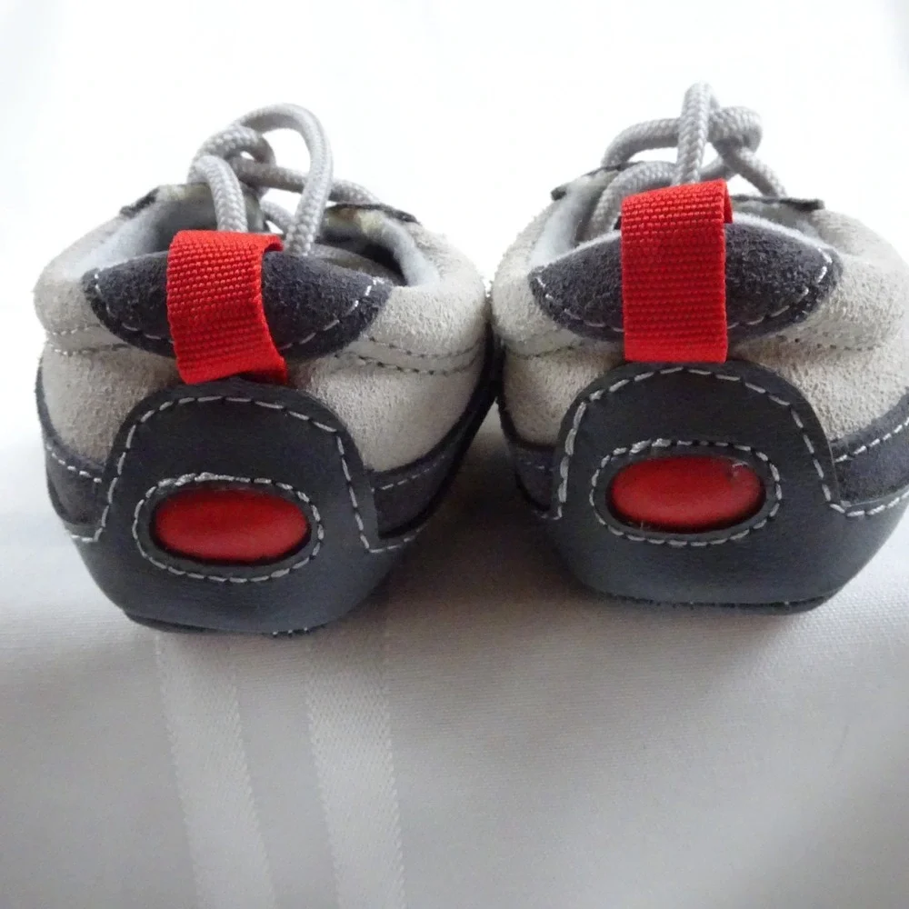2 Sets Of Vintage Infant shoes. White pair and a Gray/Red pair.